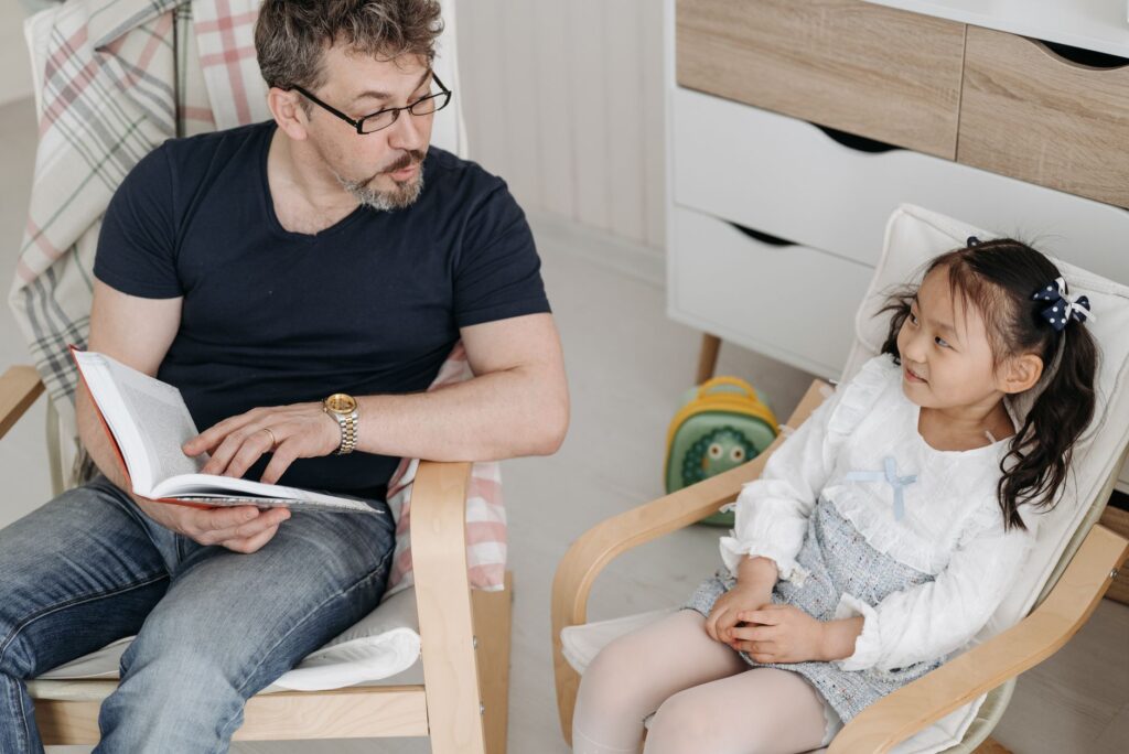 Parent helping a child develop confidence through reading